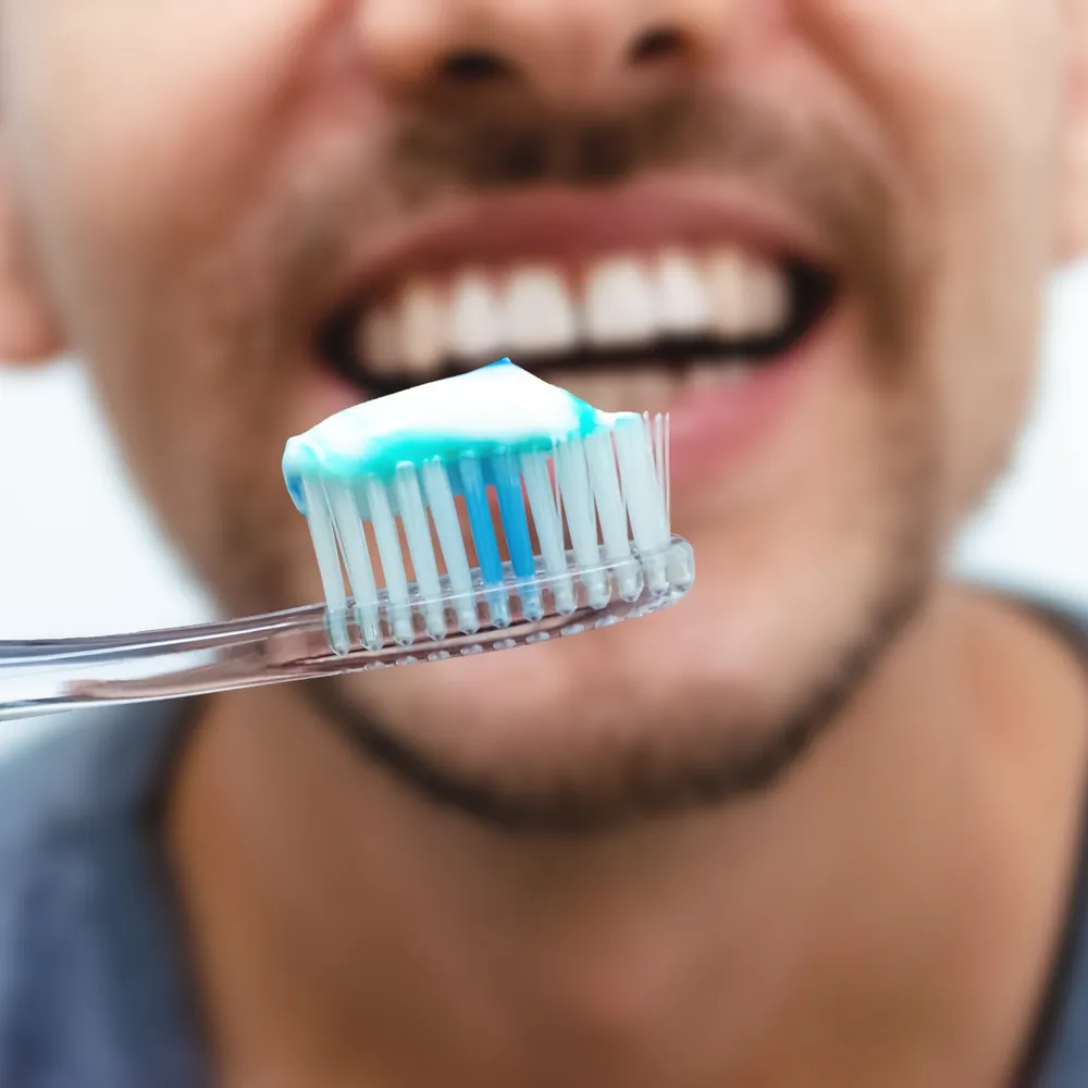 Close-up of a toothbrush, part of routine preventive dental care