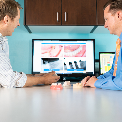 Dr. Rogers and Dr. Mink examining x-rays.