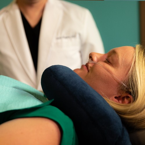 Closeup of female patient during sedation dentistry.