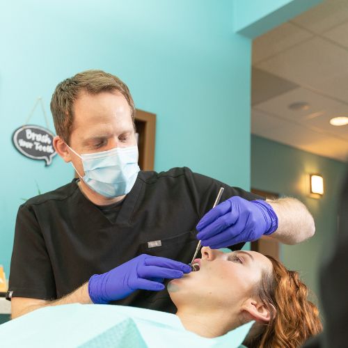 Dr. Mink examining patient.