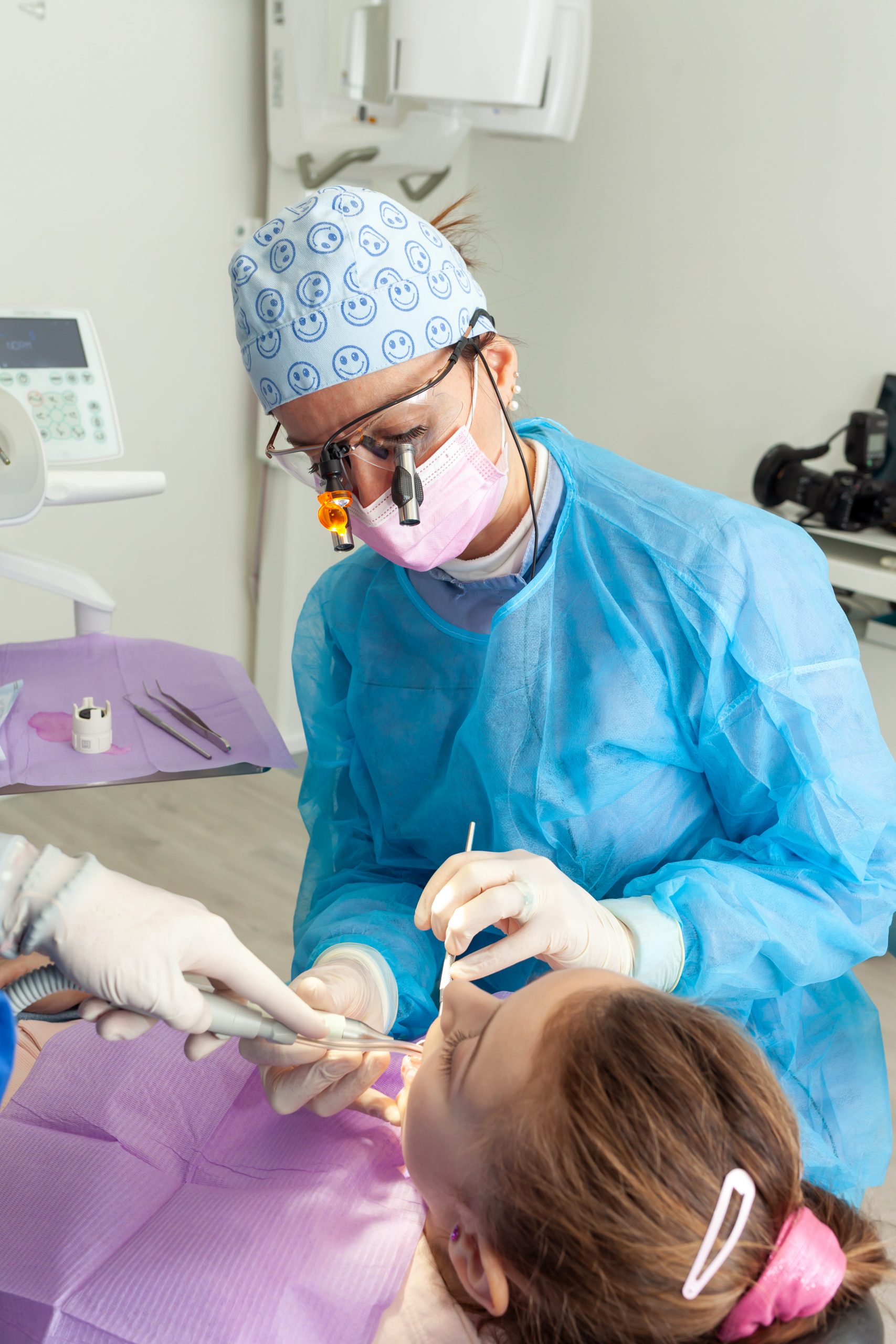 dentist examining teeth of patient